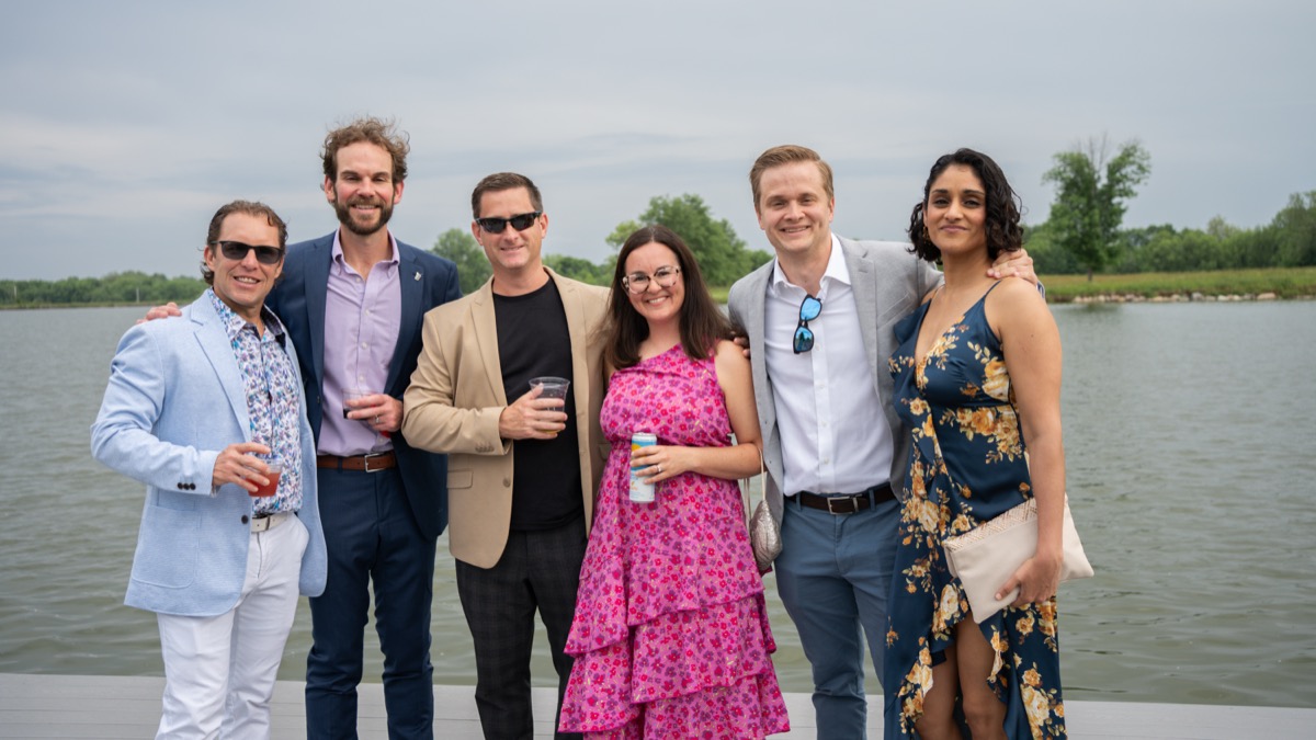 Guests on the lakefront at The Agency Indianapolis event