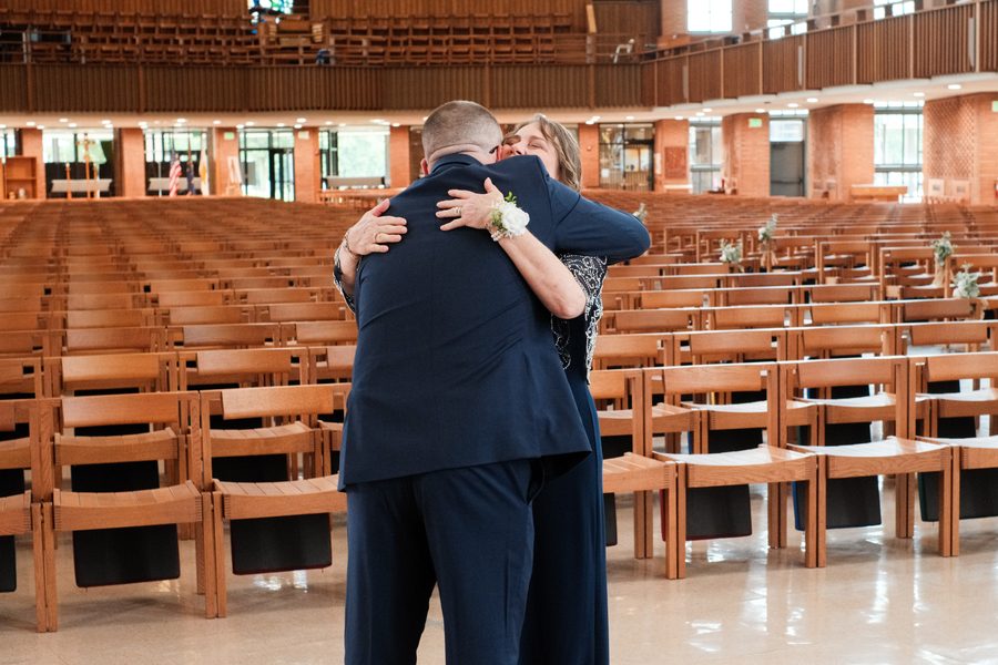 Eric hugging his mom in the chapel