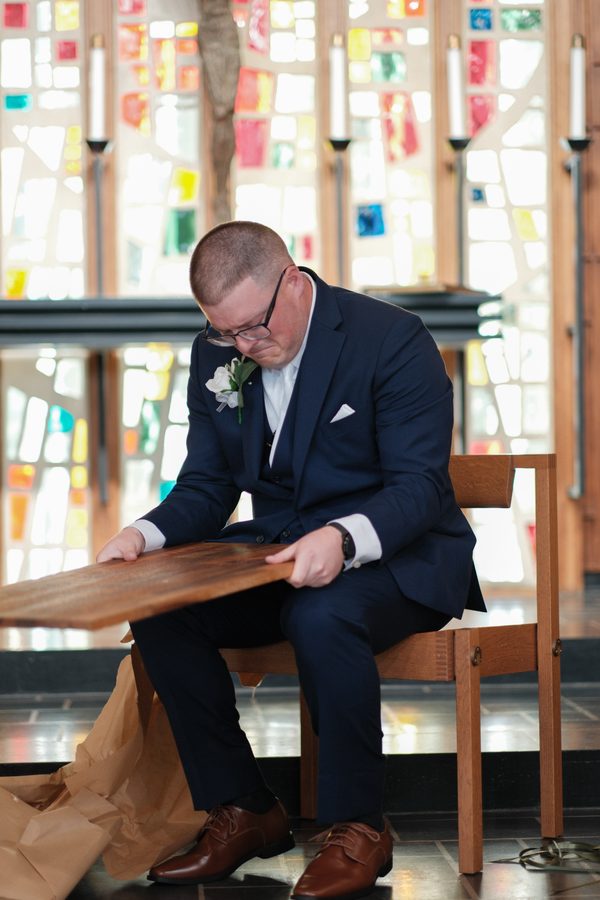 Eric reading the letter engraved on the board
