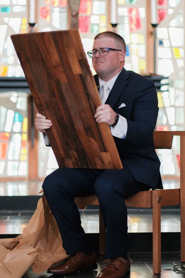 Eric holding up the engraved board