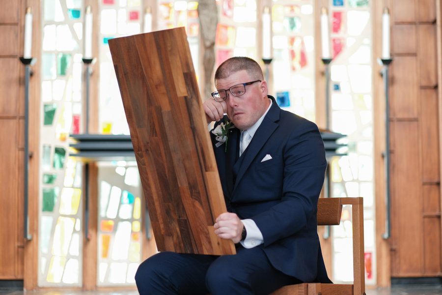Eric emotional over the engraved letter from his parents