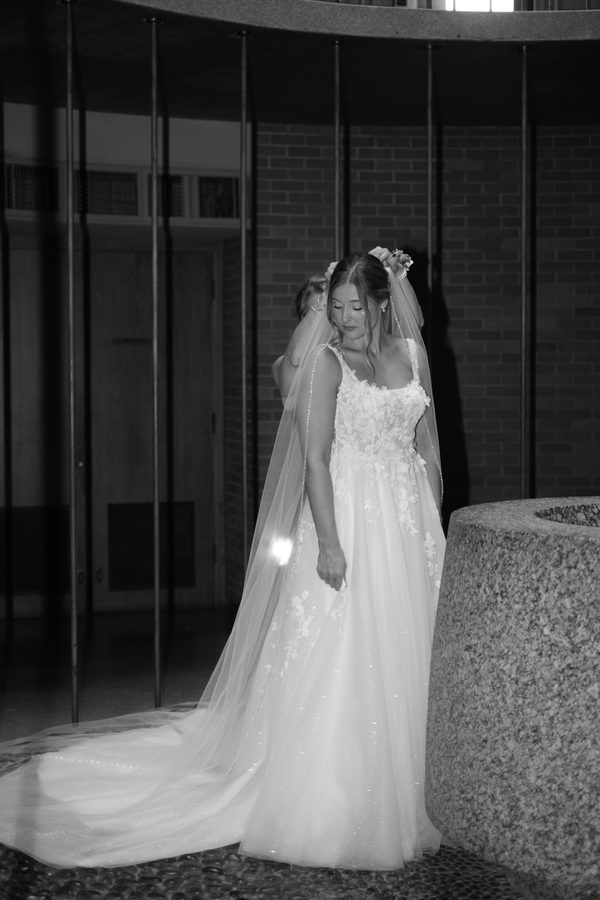 Alyssa's veil being placed, black and white