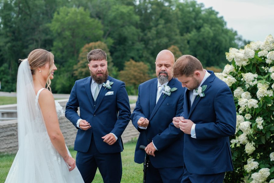 Alyssa's dad and brothers opening their cufflinks