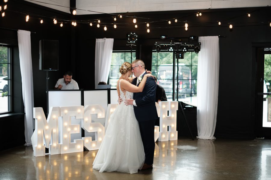 Alyssa and Eric slow dancing at The Design Barn