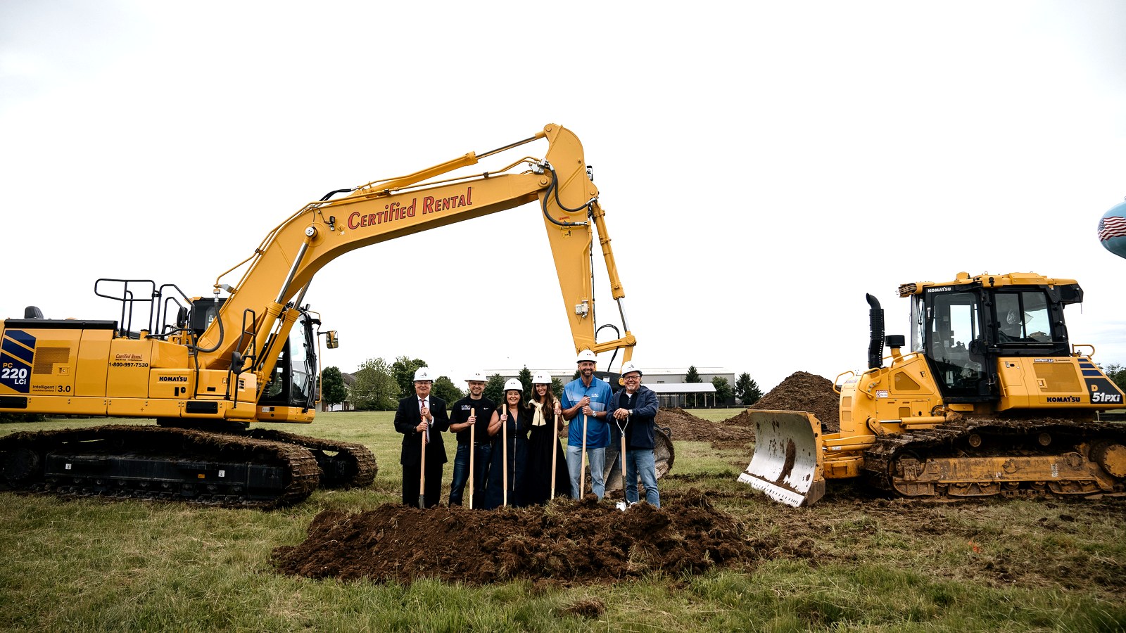 The Johnson's Excavation team breaking ground between two excavators
