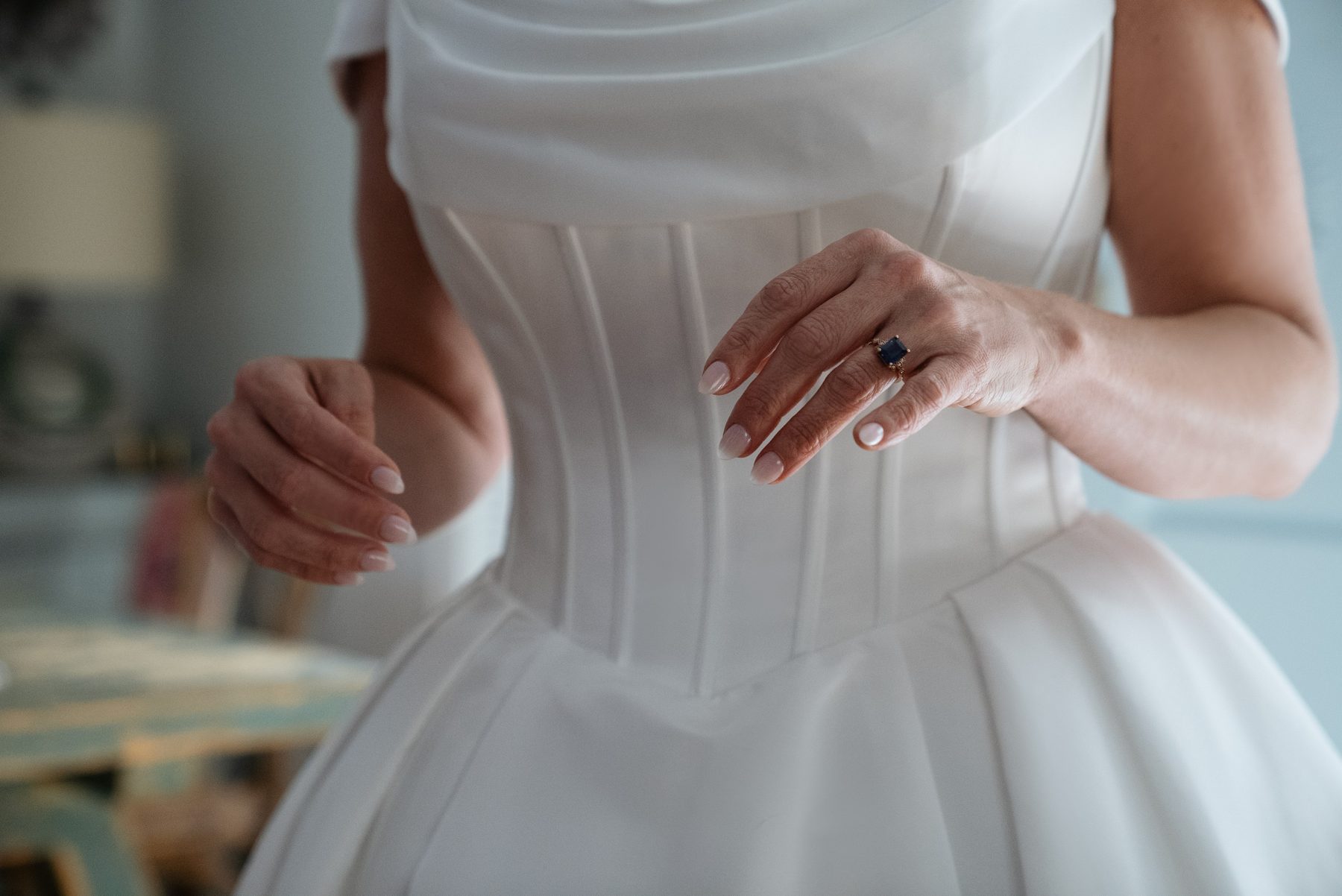 The back of Pary's dress being done up
