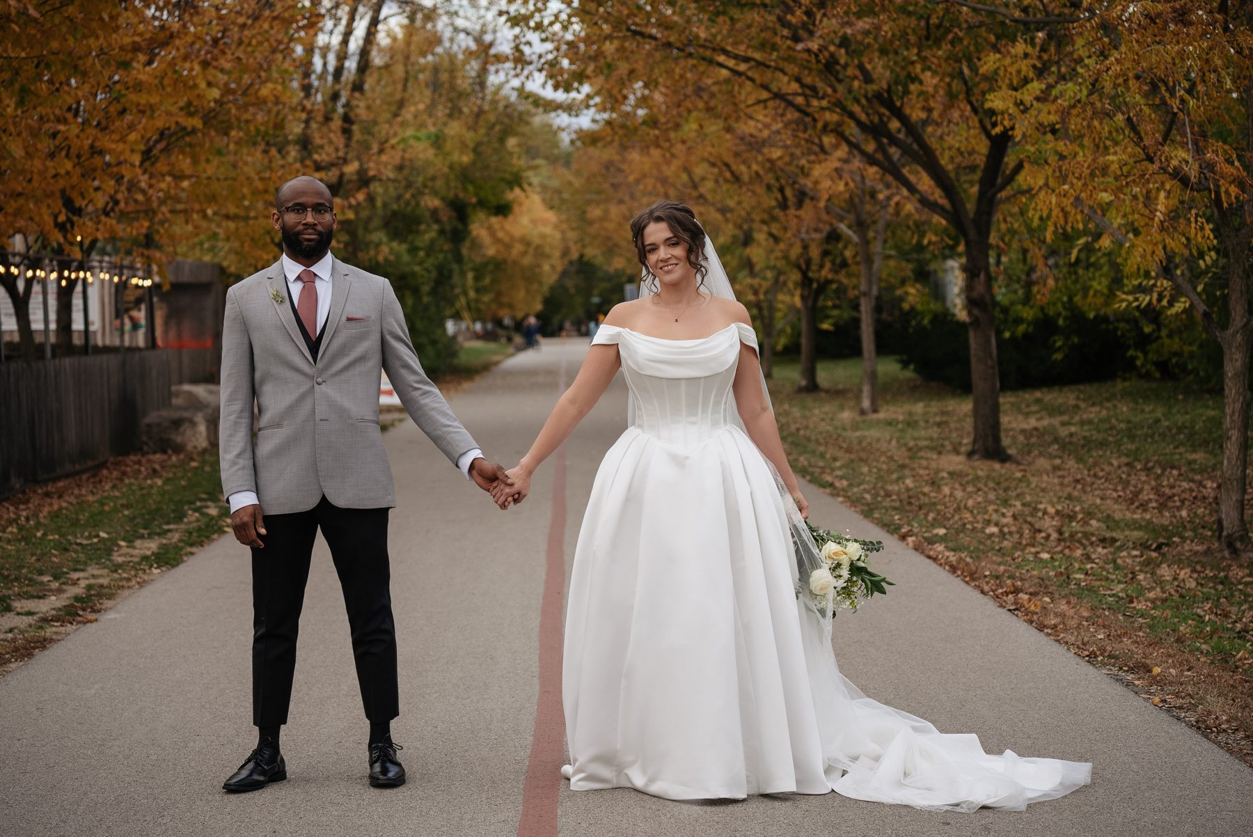 Pary and Edward holding hands on the Monon Trail