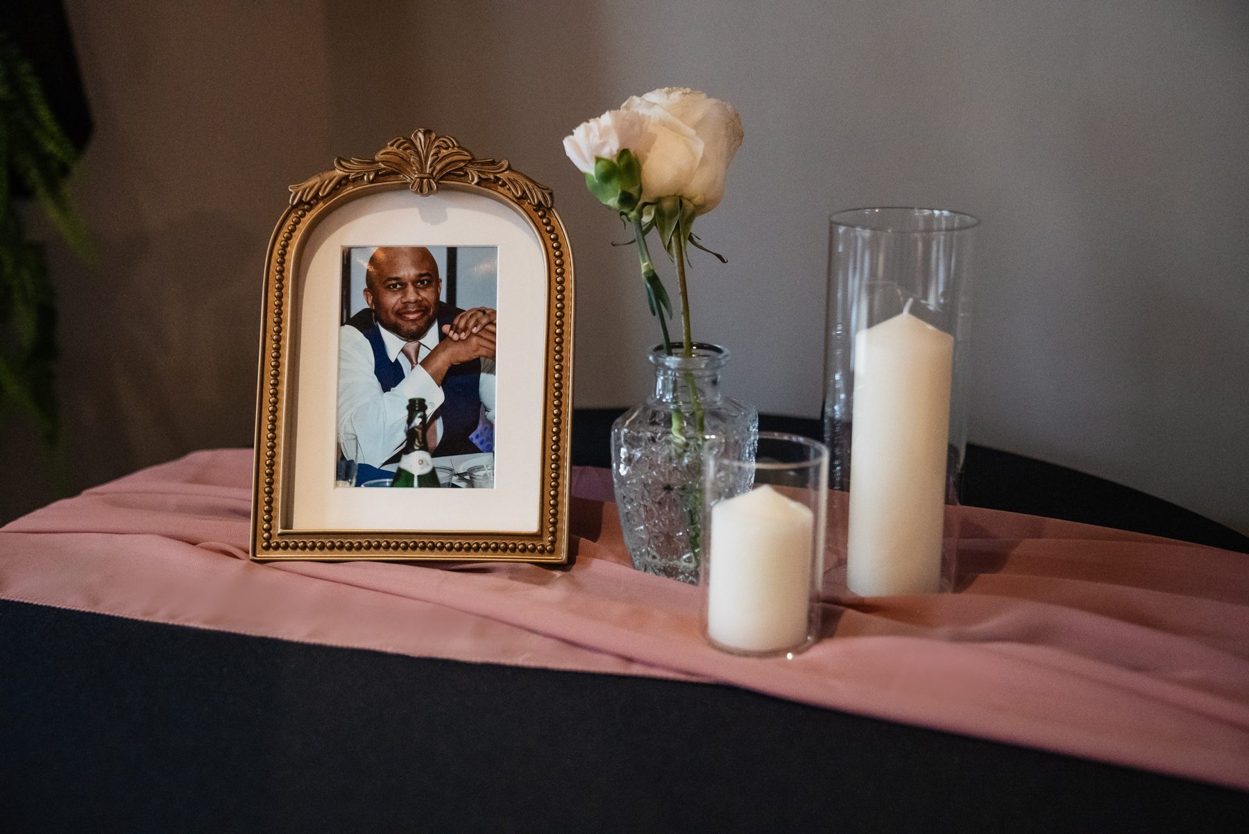 A framed photo of Edward's brother on the memorial table